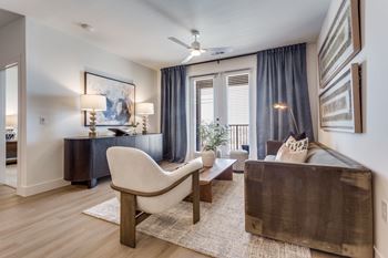 Wood-style flooring in living, dining, and bath areas